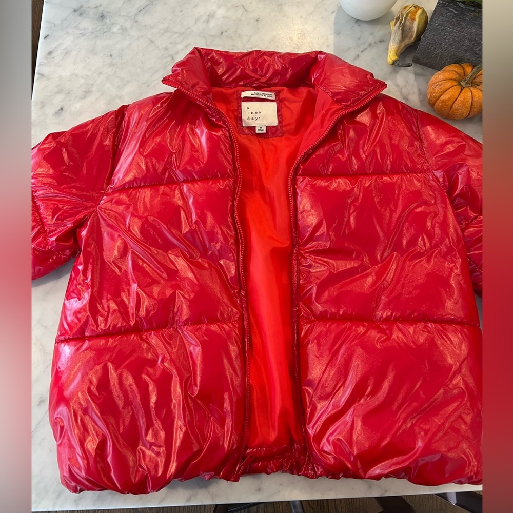 A new day, red shiny puffer jacket. Size medium women’s.